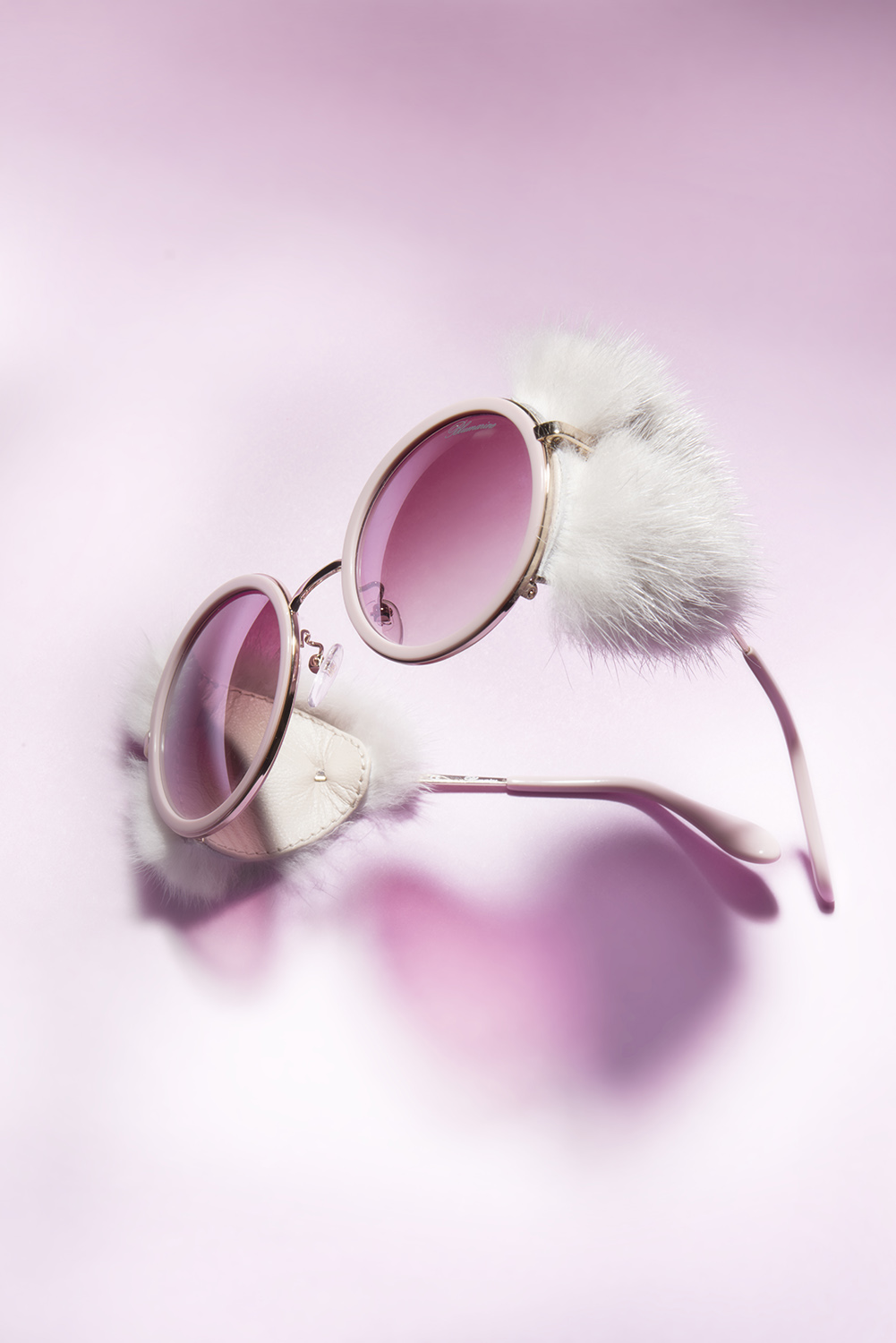 blumarine anniversary apres ski sunglasses on pink background