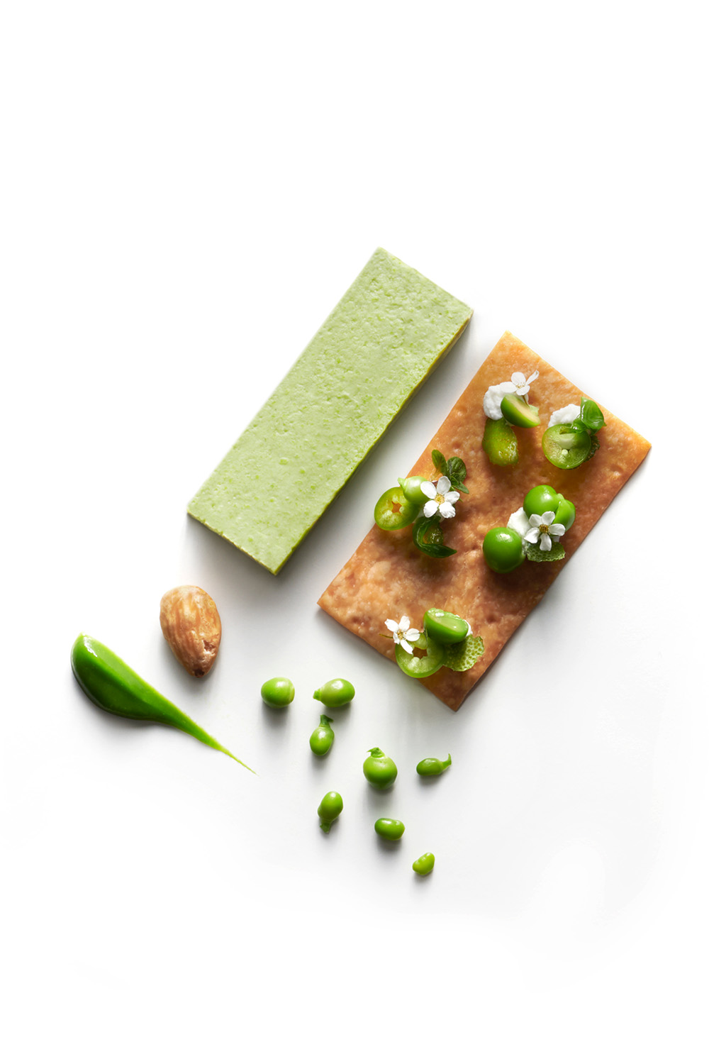 peas pudding and almonds on white background by chef marcello passoni cucina nomade