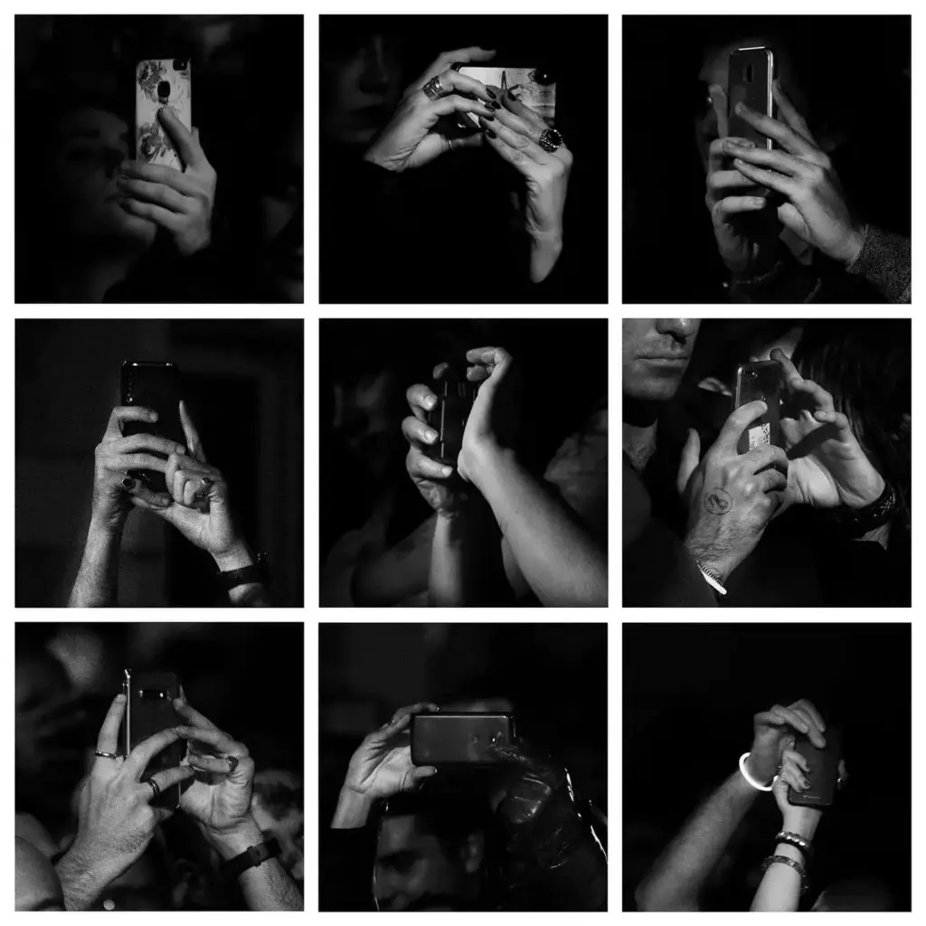 hands holding cell phones