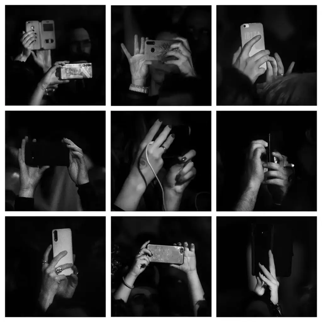 hands holding cell phones