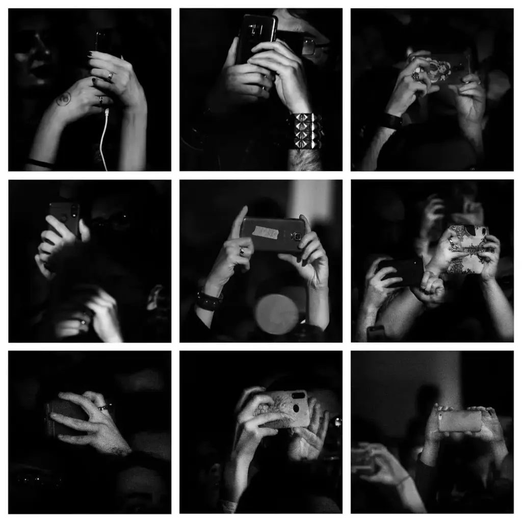 hands holding cell phones