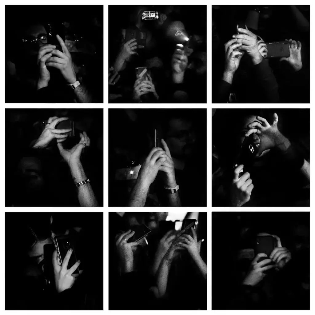 hands holding cell phones